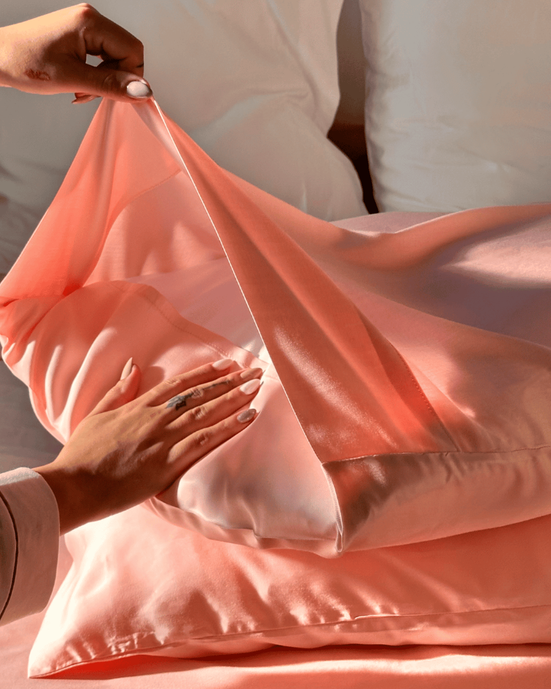 Hand closing a pink envelope with simple and efficient closure