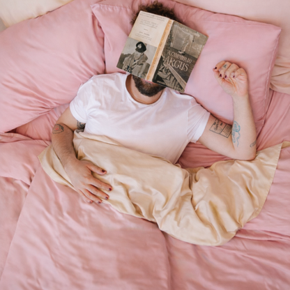 Detailed view of slightly wrinkled pink bamboo fabric, showcasing its natural, relaxed finish.