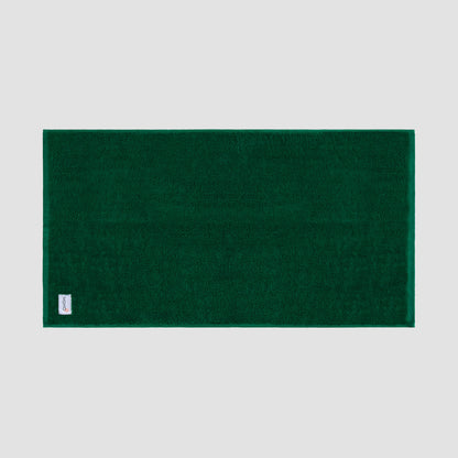 Tapete de banho verde em bambu da Momo Cotton – suave, absorvente, seca rapidamente e sustentável.